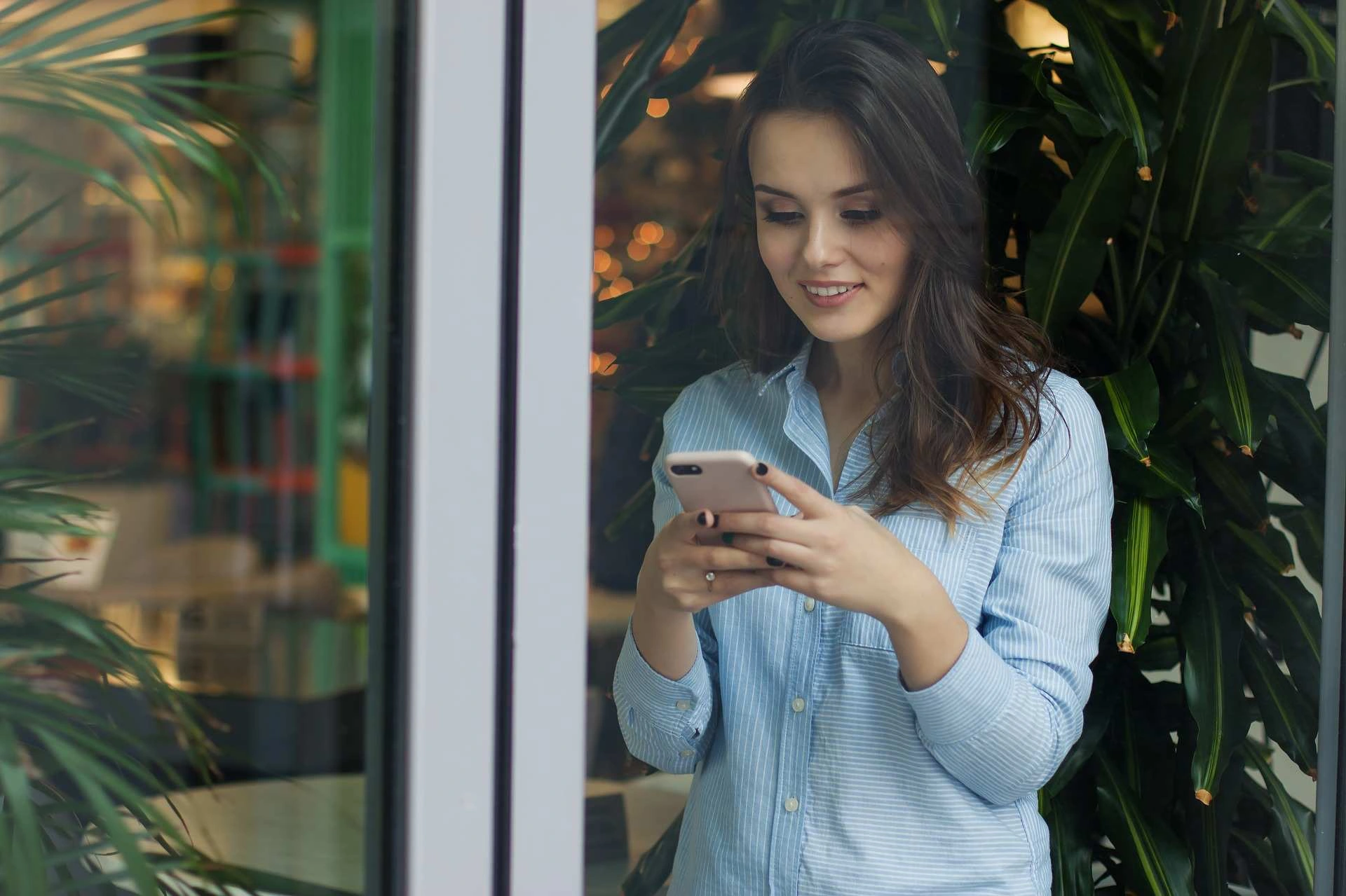 Customer using a mobile phone to request transportation